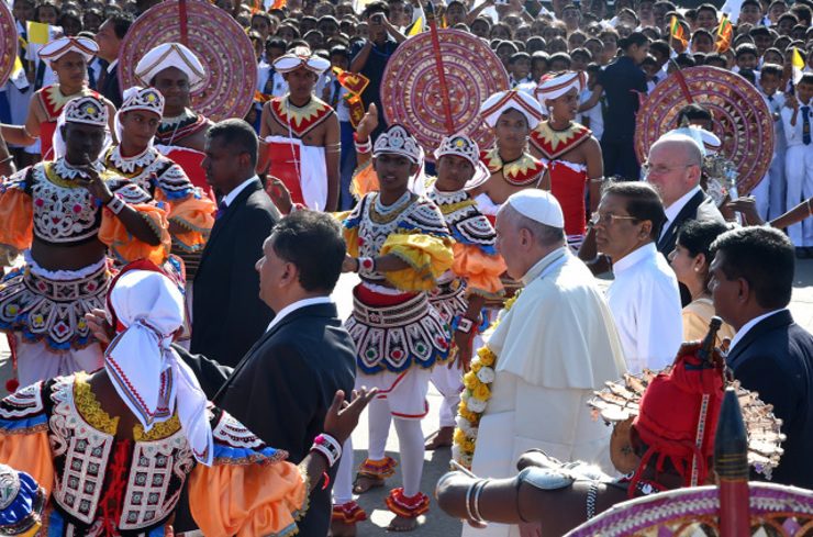COLORFUL WELCOME. Pope Francis and Sri Lankan President Maithripala Sirisena pass through dancers in Colombo airport, Sri Lanka, 13 January 2015. Photo by Ettore Ferrari/EPA 