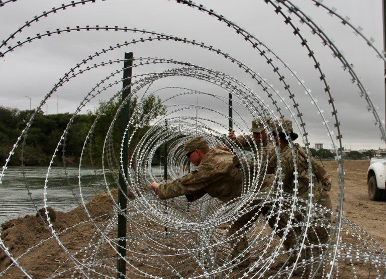 U.S. Army unfurls miles of fencing along border with Mexico