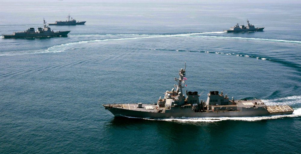 US RESPONSE. A handout photo released by the US Navy dated 25 May 2015 of the guided-missile destroyer USS Lassen (front). USS Lassen sailed within 12 nautical miles of Subi Reef in the Spratly archipelago, one of the areas where Beijing has allegedly been building artificial islands. Photo by Naval Air Crewman Evan Kenny/EPA 