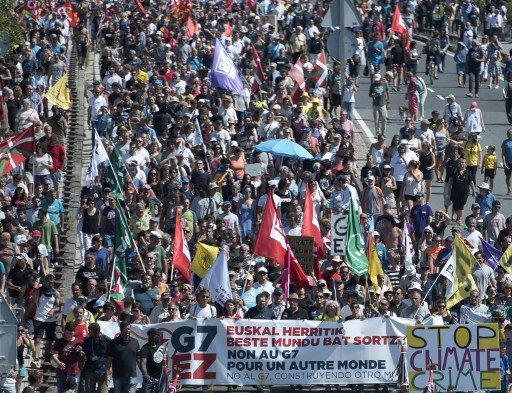 Thousands join anti-G7 march as world leaders fly in