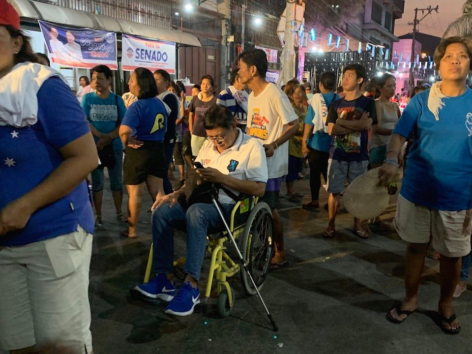 SUPPORTER. A Duterte supporter attends the Malabon rally in a wheelchair. Photo by Camille Elemia/Rappler 