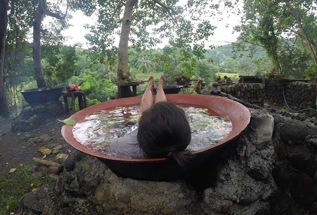 UNWIND. Narl takes a relaxing dip in a giant kawali in Antique 