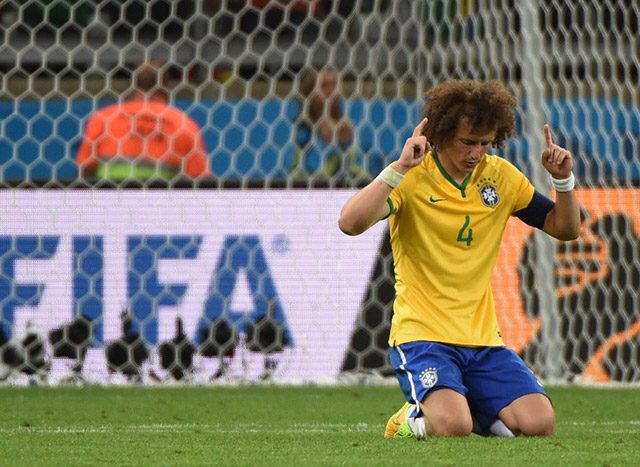 Brazil skipper David Luiz sat to his knees to offer a prayer as the referee blew the whistle to signal the end of the brutal match against Germany Photo by Pedro Ugarte/AFP