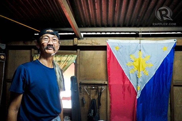 'REBEL'. Ramon Hormillo at his residence with the Pacquiao flag.