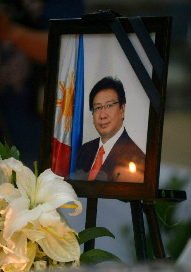 MAN OF GOD. A photo of Philippine Ambassador to Pakistan Domingo Lucenario Jr is displayed during a memorial service at the Philippine Department of Foreign Affairs on May 15, 2015. Photo by Jay Directo/AFP 