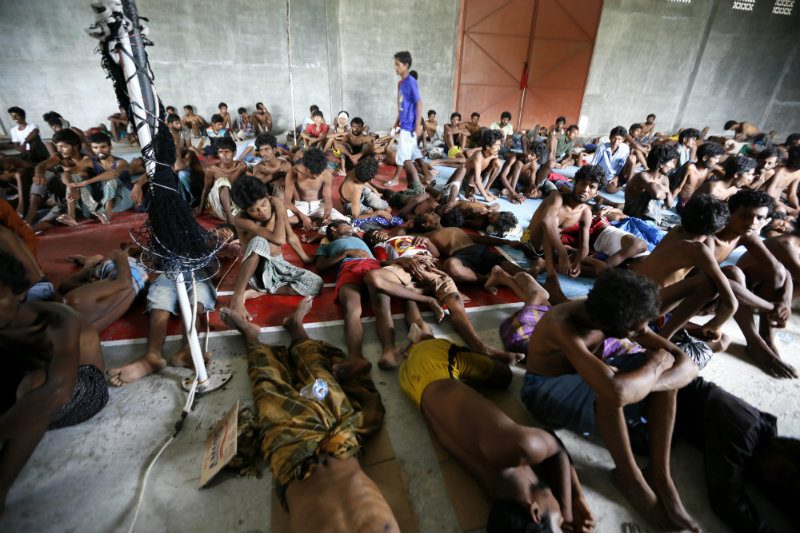 Refugees take a rest after being save from the sea in Kuala Langsa, East Aceh, Indonesia, 15 May 2015. Photo by Hotli Simanjuntak/EPA 