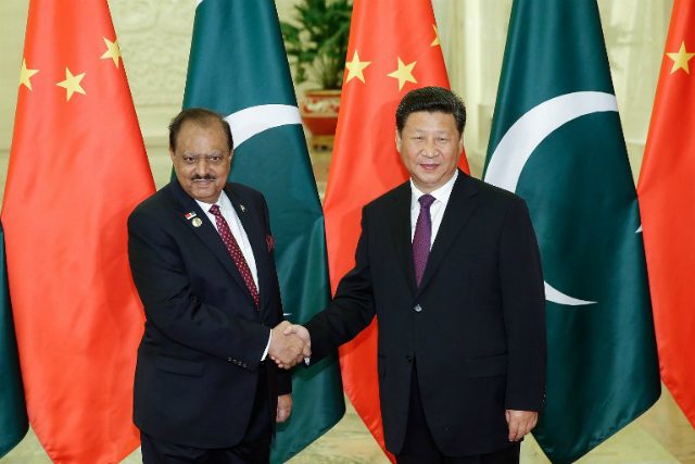 STRONG RELATIONSHIP. Chinese President Xi Jinping (R) shakes hands with Pakistani President Mamnoon Hussain (L) before their meeting at the Great Hall of the People in Beijing on September 2, 2015. File photo by Lintao Zhang/AFP   