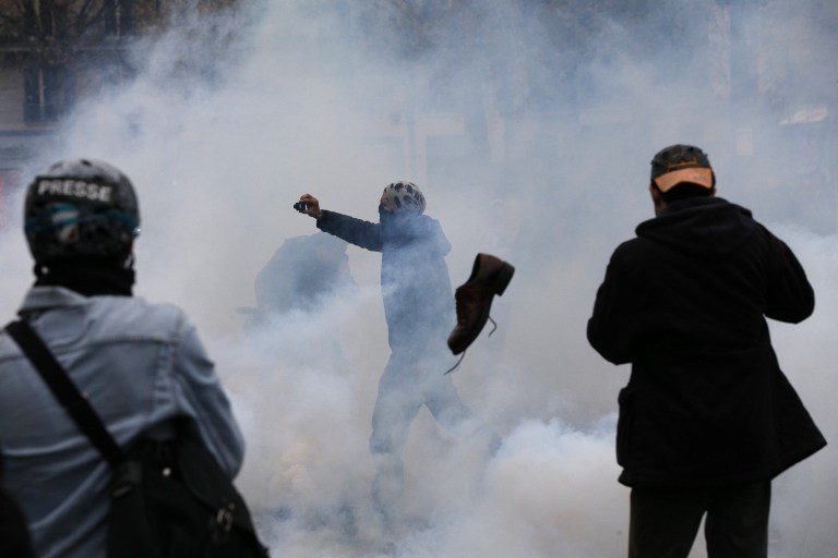 Paris police detain 208 after climate change demo