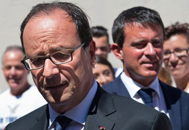 French President Francois Hollande (L) and French Prime Minister Manuel Valls (R) arrive at the Fort de Bregancon for a meeting in Bornes-les-Mimosas, France, 15 August 2014. Bertrand Langlois/Pool/EPA