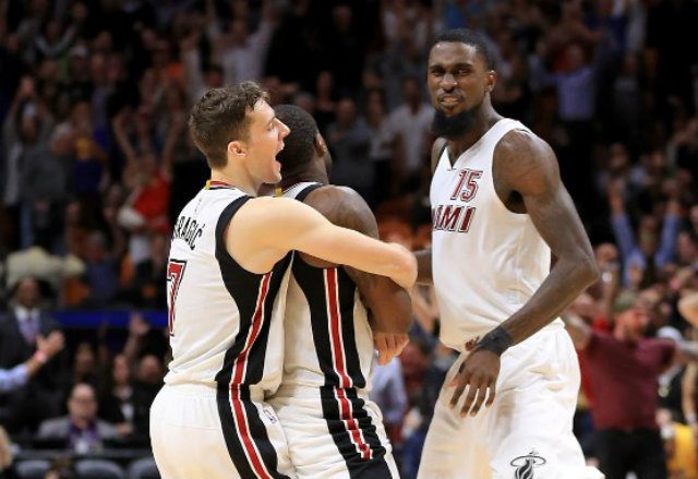 GAME-WINNER. Dion Waiters of the Miami Heat is congratulated by Goran Dragic after hitting the game-winner against the Golden State Warriors at American Airlines Arena on January 23, 2017 in Miami, Florida. Mike Ehrmann/Getty Images/AFP 