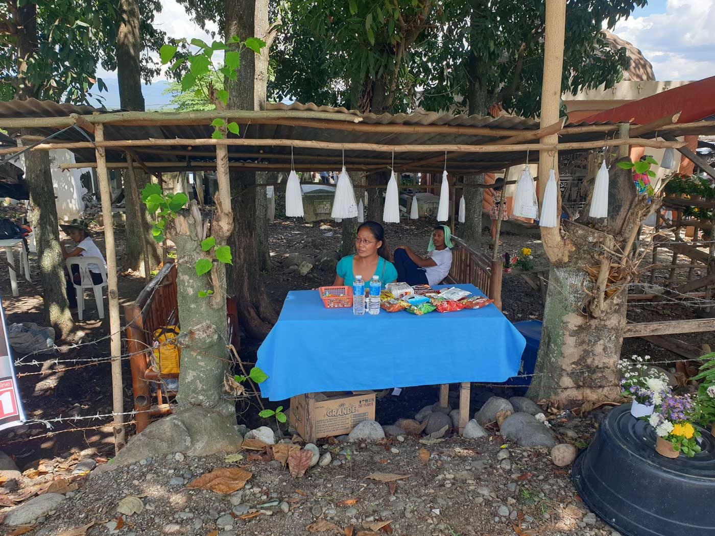SLOW BUSINESS. Amie remotigue tends her store beside the Magsaysay cemetery in Davao del Sur.