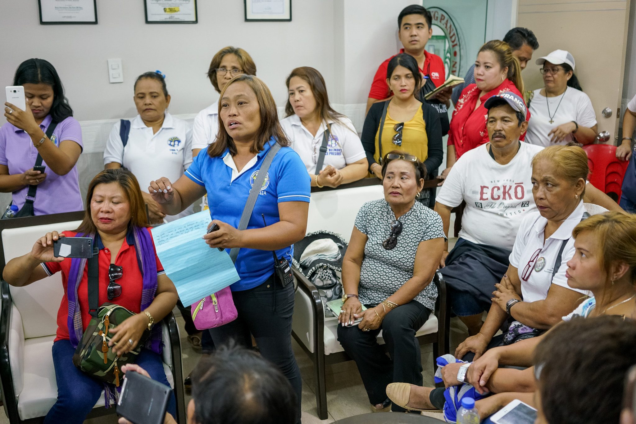 FAIR TREATMENT. Leaders of several homeowners' associations from different housing projects in Pandi, Bulacan demand attention to their needs. Photo by Martin San Diego/Rappler  