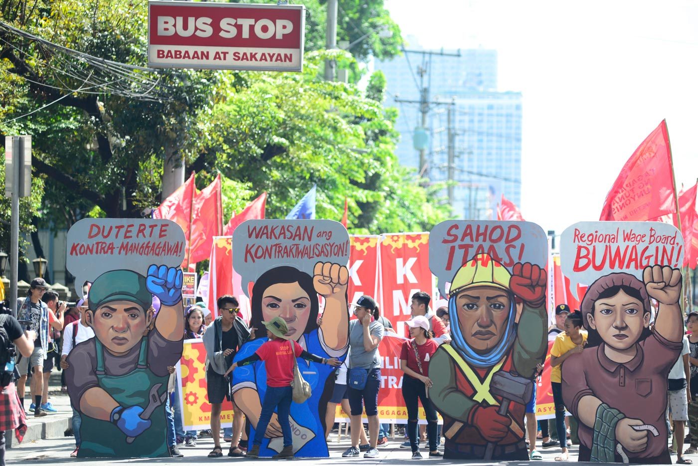 PLACARDS. Kilusang Mayo Uno brings in their placards when they converged with other labor groups along España on May 1, 2018. Photo by Maria Tan/Rappler  
