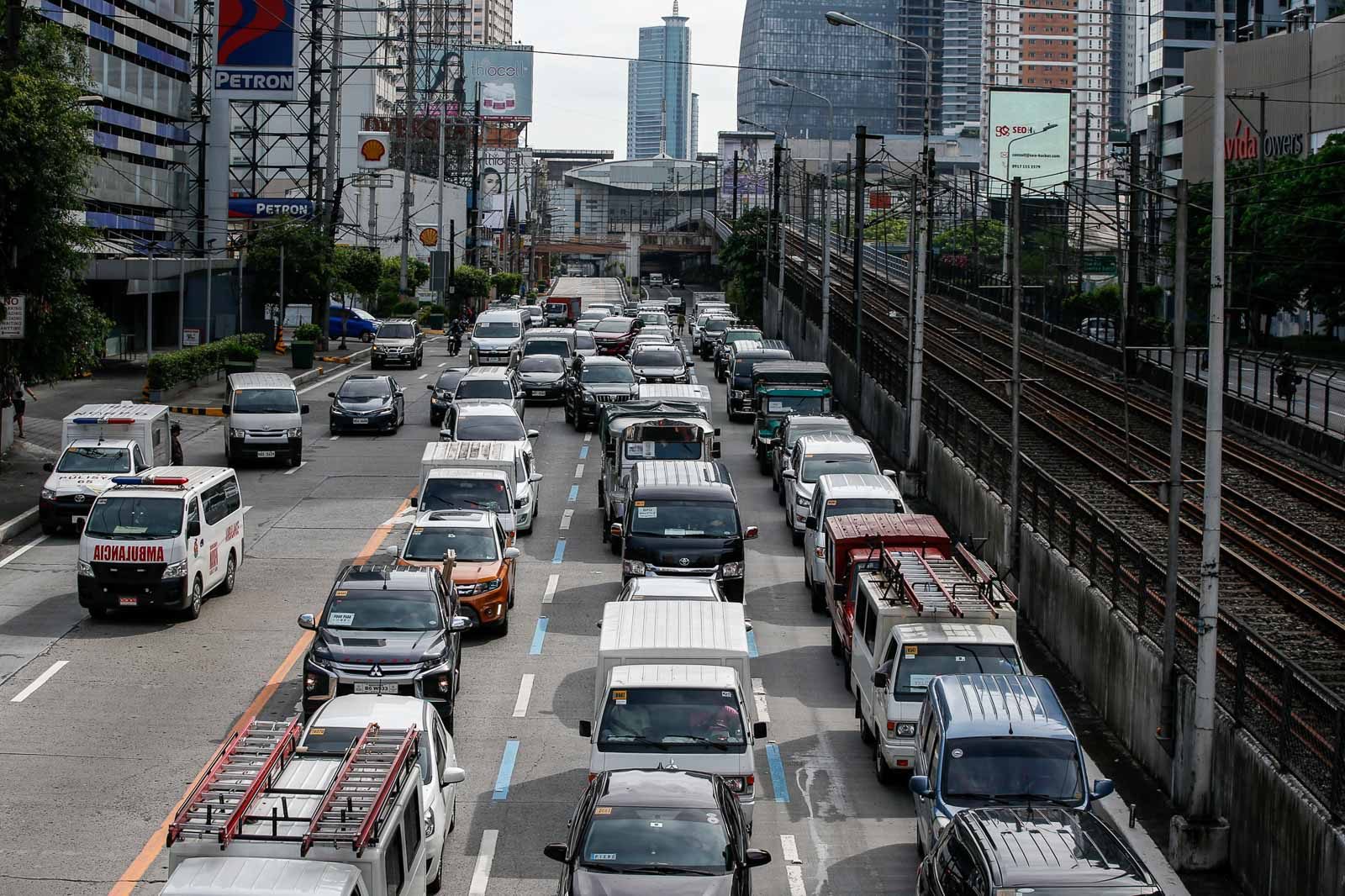 OLD NORMAL AGAIN. Vehicle traffic builds up at a checkpoint along EDSA in Mandaluyong City on May 16, 2020, the start of the MECQ Photo by Czar Dancel/Rappler 