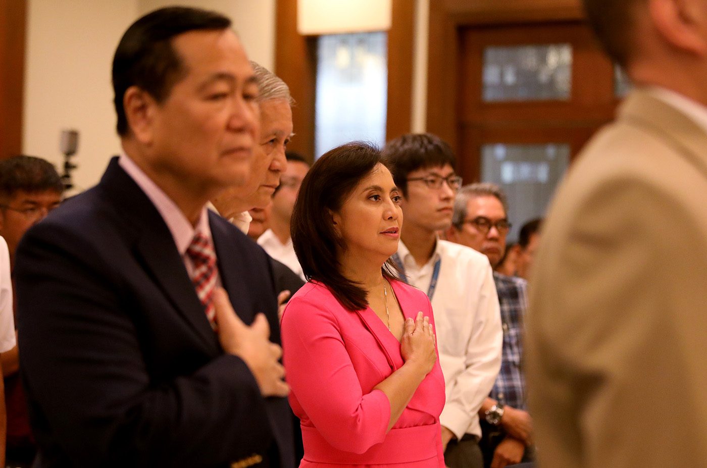 PROTECTING SOVEREIGNTY. Robredo sings the national anthem beside ex-foreign affairs chief Albert del Rosario and acting Supreme Court Chief Justice Antonio Carpio, who both defended the Philippines' rights over the West Philippine Sea against China in The Hague. Photo by OVP
  