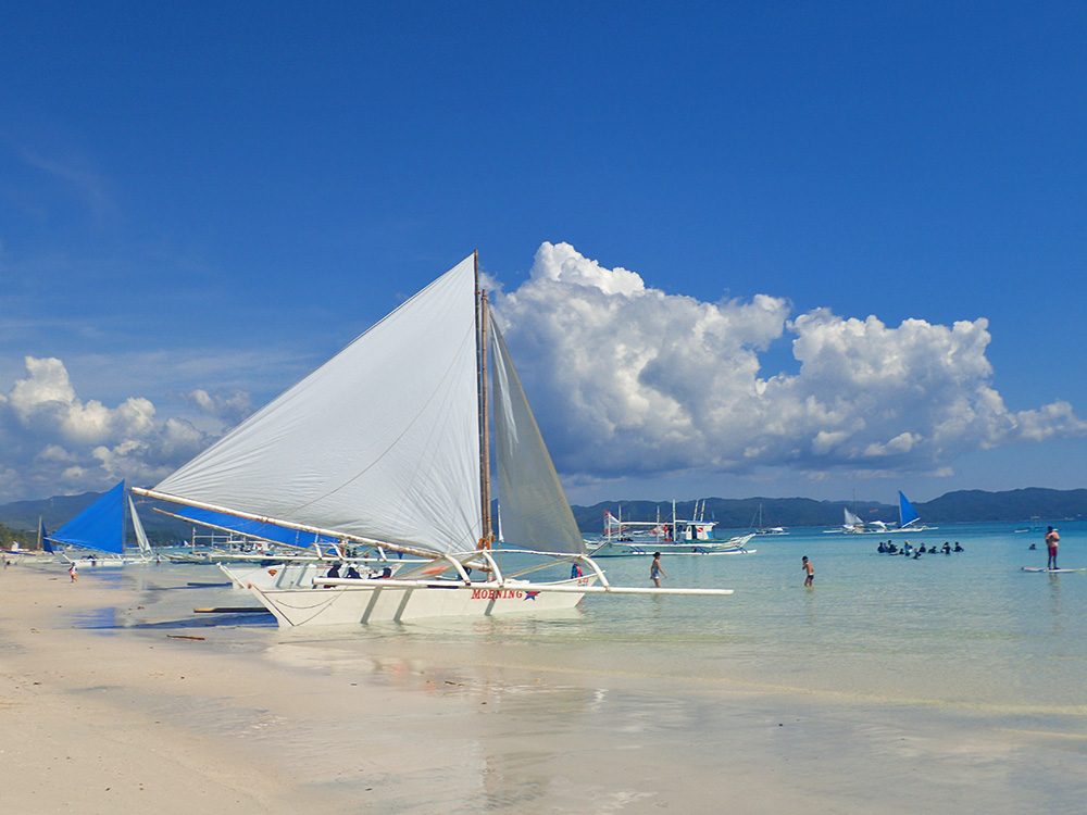 SAIL AWAY. Paraws are everywhere on White Beach’s waters, and you can ride them, too. 