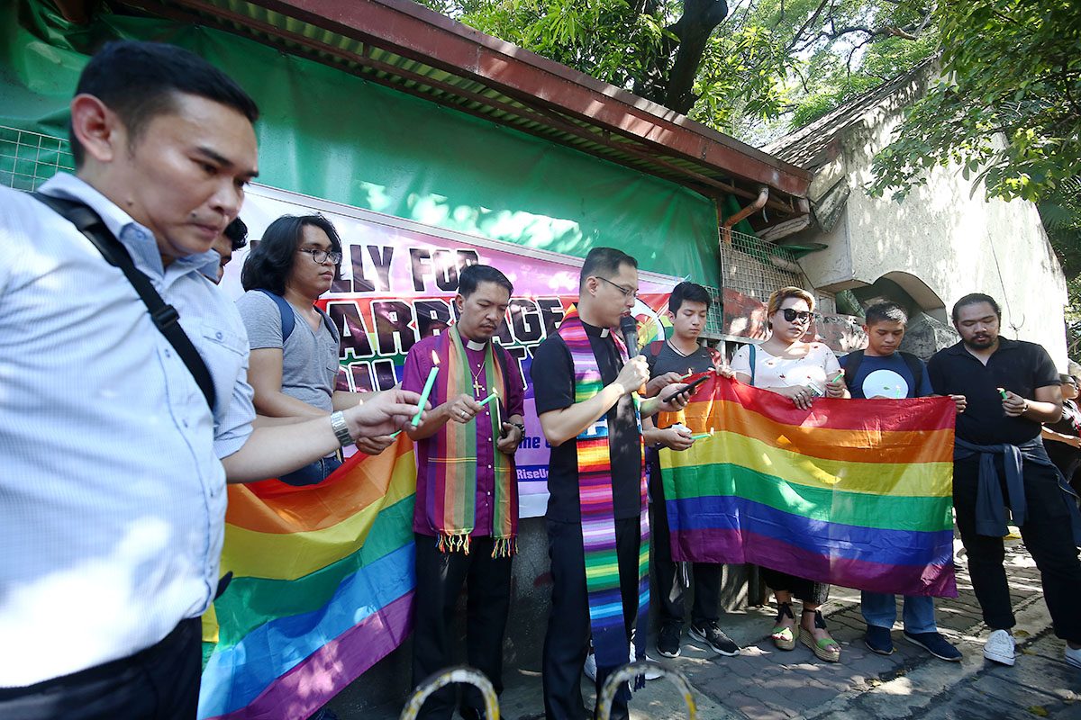 WE ARE FAMILY. LGBTQ groups and supporters hold a prayer during a rally for gender equality in front of the Supreme Court hearing the petition on same-sex marriage on June 19, 2018. Photo by Ben Nabong/Rappler    