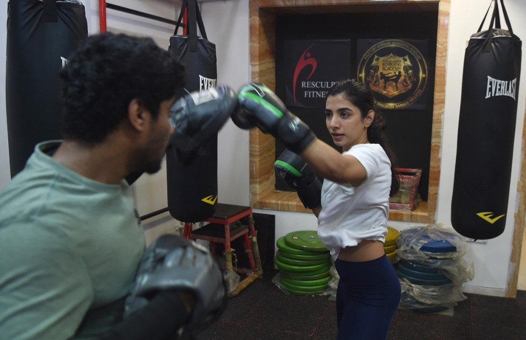 PREPARATION. Aspiring actress Malhaar Rathod trains in a kickboxing session at a gym in Mumbai. Photo by Punit Paranjpe/AFP  