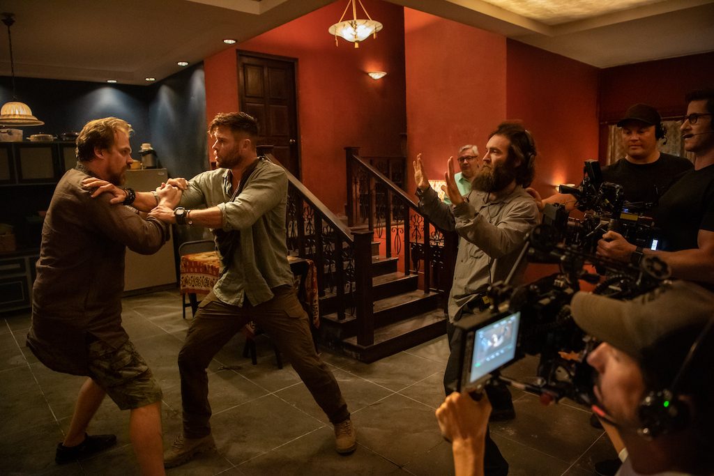 BEHIND-THE-SCENES. Sam Hargrave directs David Harbour and Chris Hemsworth on the set of 'Extraction.' Photo courtesy of Netflix 