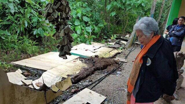 BROKEN. Education secretary Leonor Briones inspects a school damaged by the 6.7 magnitude earthquake that struck Northern Mindanao on February 10. Photo by DepEd 