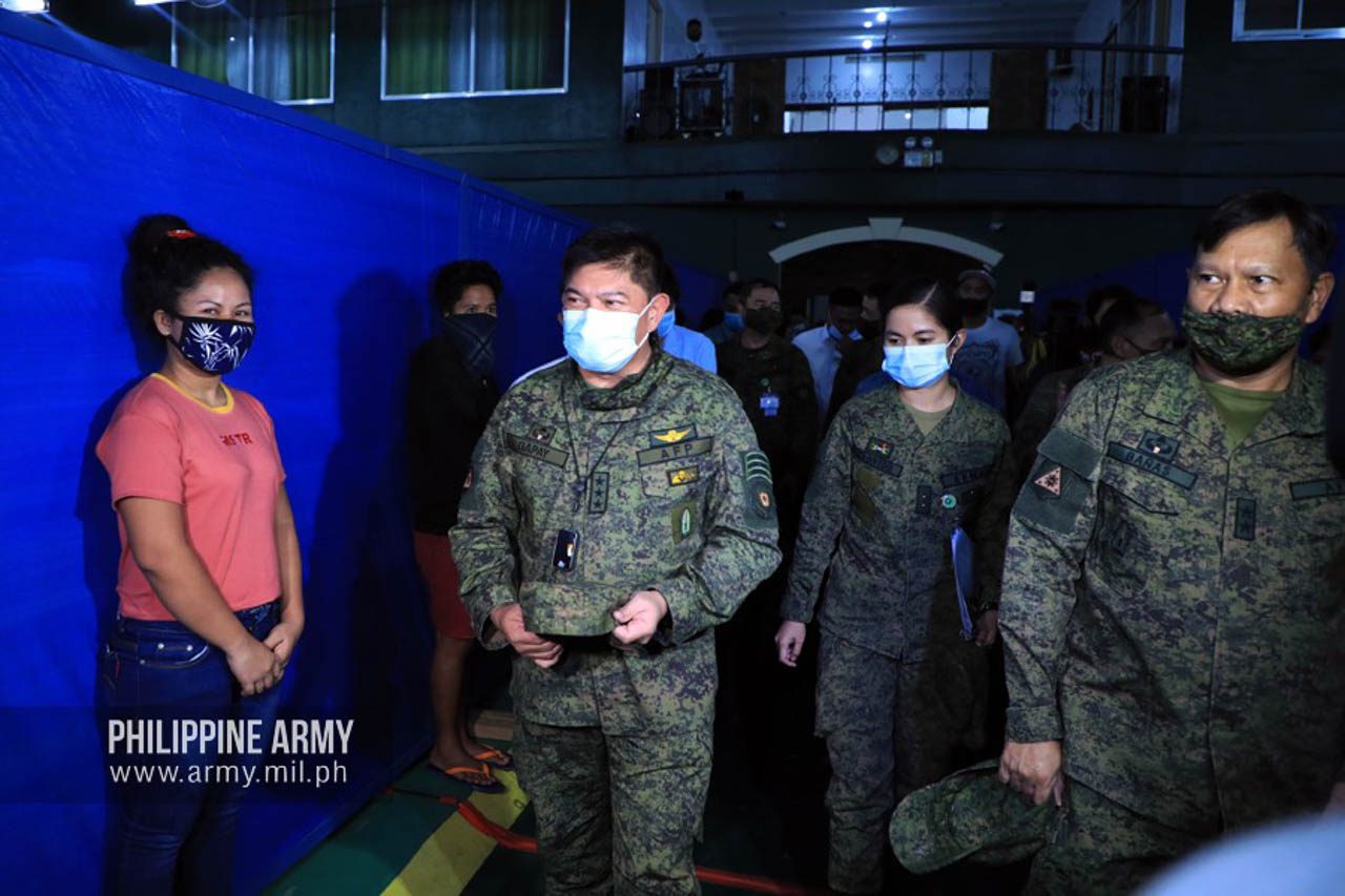 ARMY CHIEF. Army commanding general Lieutenant General Gilbert Gapay checks on the conditions of stranded passengers staying at the Army Gymnasium on June 15, 2020. Photo from the Philippine Army 