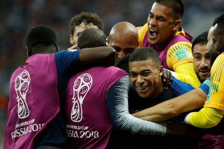 4-1. France's forward Kylian Mbappe celebrates with his teammates. Photo by Odd Andersen/AFP  
