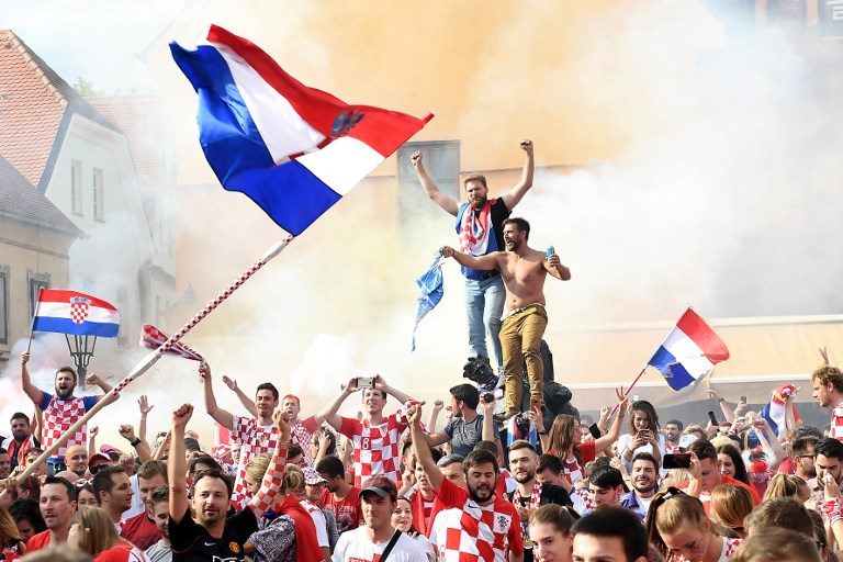 JUBILATION. Supporters cheer in downtown Zagreb on July 15, 2018, after Croatia scores an equalizer during the 2018 Russia World Cup final football match against France. Photo by Attila Kisbenedek/AFP   