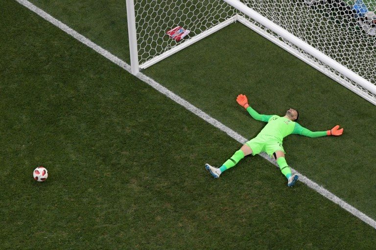 3-1. Croatia's goalkeeper Danijel Subasic falls on the pitch after conceding a third goal. Photo by François-Xavier Marit/AFP   