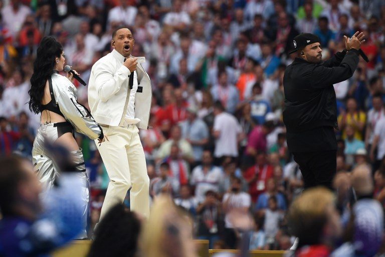 'LIVE IT UP'. Will Smith (center), American singer Nicky Jam (right), and Kosovar artist Era Istrefi perform during the closing ceremony at the Luzhniki Stadium. Photo by Jewel Samad/AFP   