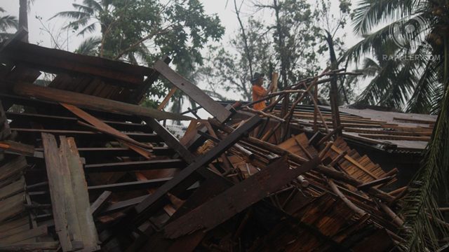 DEVASTATED. The storm uprooted trees and tore roofs off houses and nipa huts. Photo by Karlos Manlupig