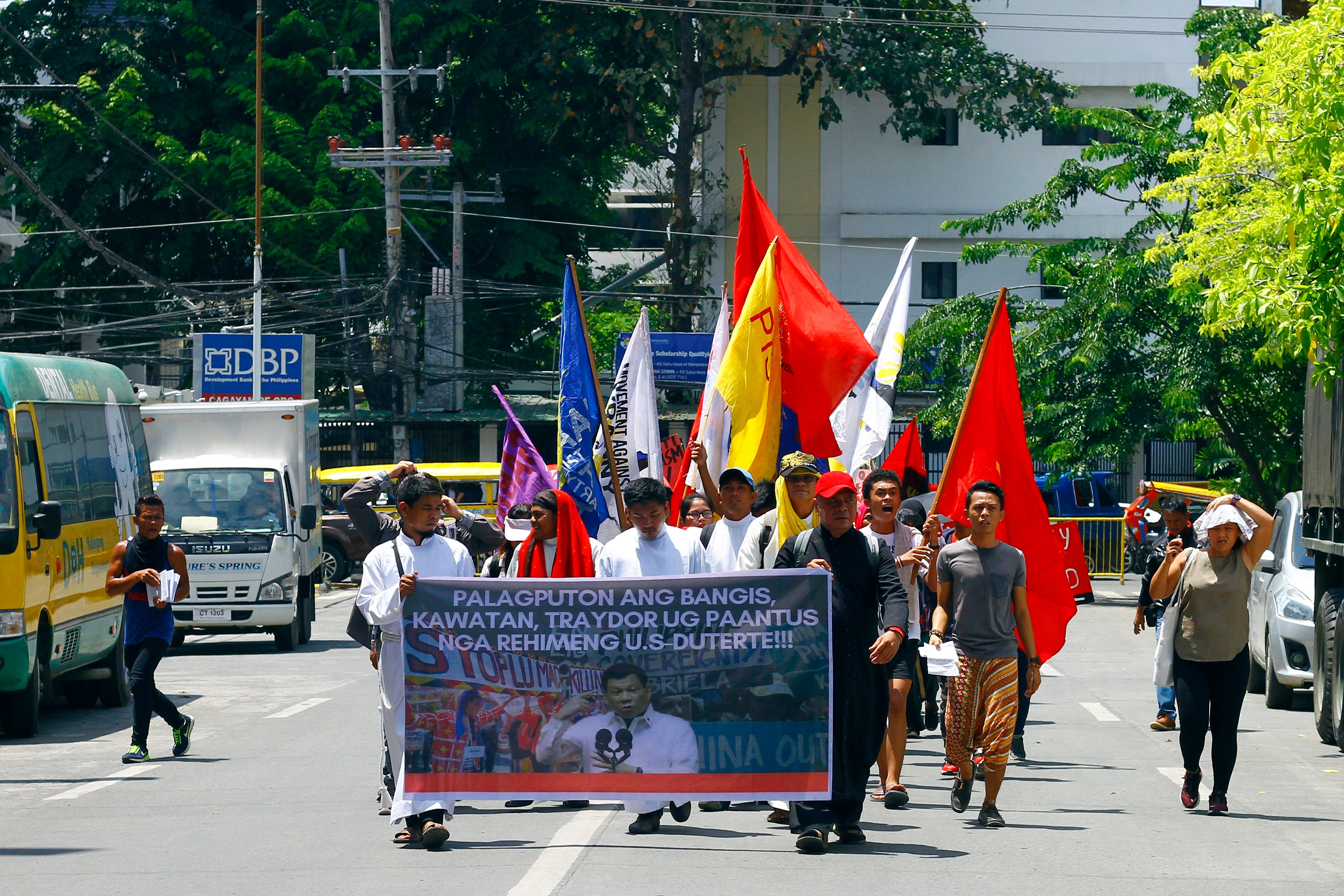 CAGAYAN DE ORO. Protesters walk through historic Plaza Divisoria in Cagayan de Oro City on July 22, 2019. Photo by Bobby Lagsa/Rappler 