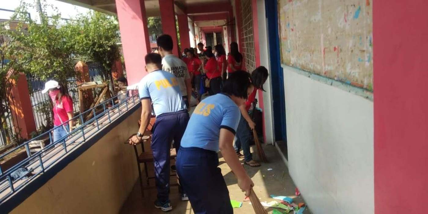RIZAL. Police personnel of the San Mateo Police Station take part in the Brigada Eskwela at the Maly Elementary School. Photo from San Mateo Police's Twitter page  