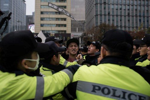 Protesters urge scandal-hit South Korea president to quit