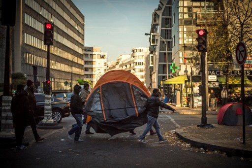 After Calais, France clears Paris migrant camp