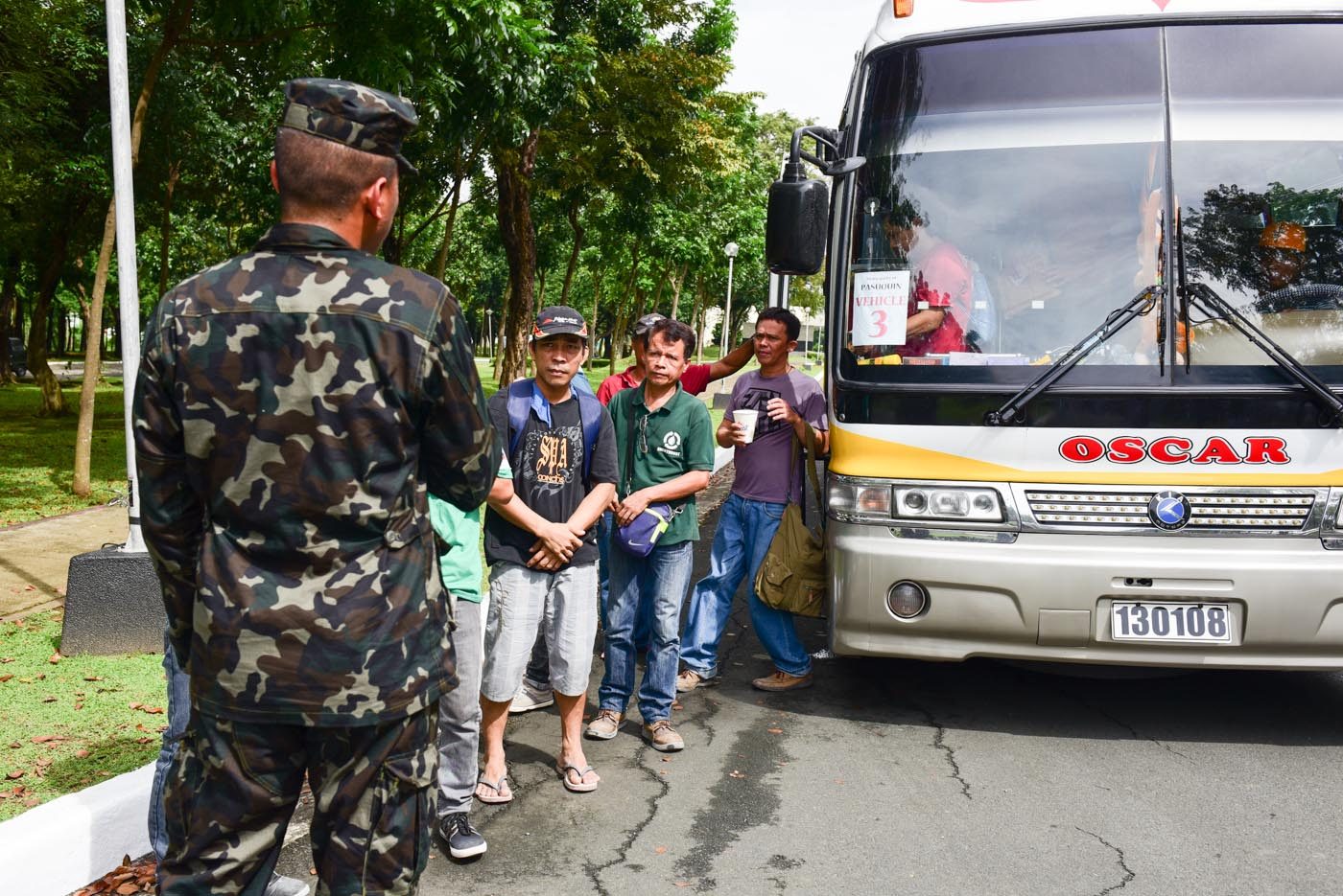 SUPPORTERS. Marcos loyalists line up outside their bus before being given the go signal to go nearer Marcos' grave. Photo by Alecs Ongcal/Rappler  