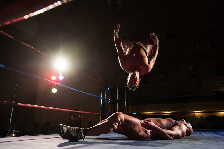 SUPERSLAM. Professional wrestlers Robbie Dynamite and Dean 'Deano' Allmark (top) take part in a bout during an evening of wrestling entertainment presented by promoter 'All Star Superslam Wrestling' in Rhyl, Wales, on August 15, 2017. Photo by Oli Scarff/AFP   