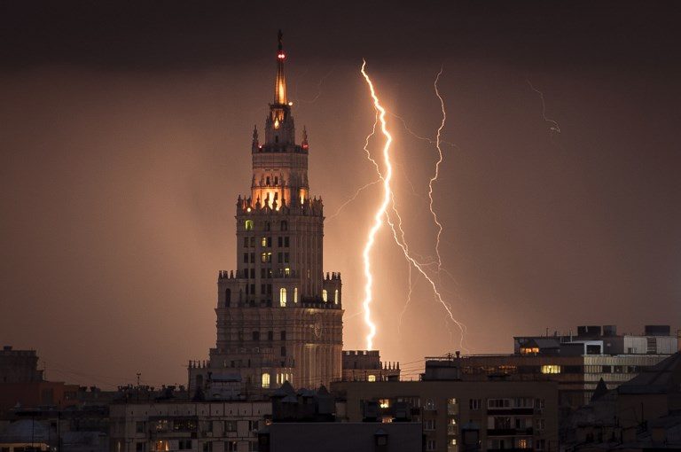 RUSSIA WEATHER. A lightning bolt strikes a Stalin-era skyscraper during a storm over Moscow on August 14, 2017. Photo by Miaden Antonov/AFP   