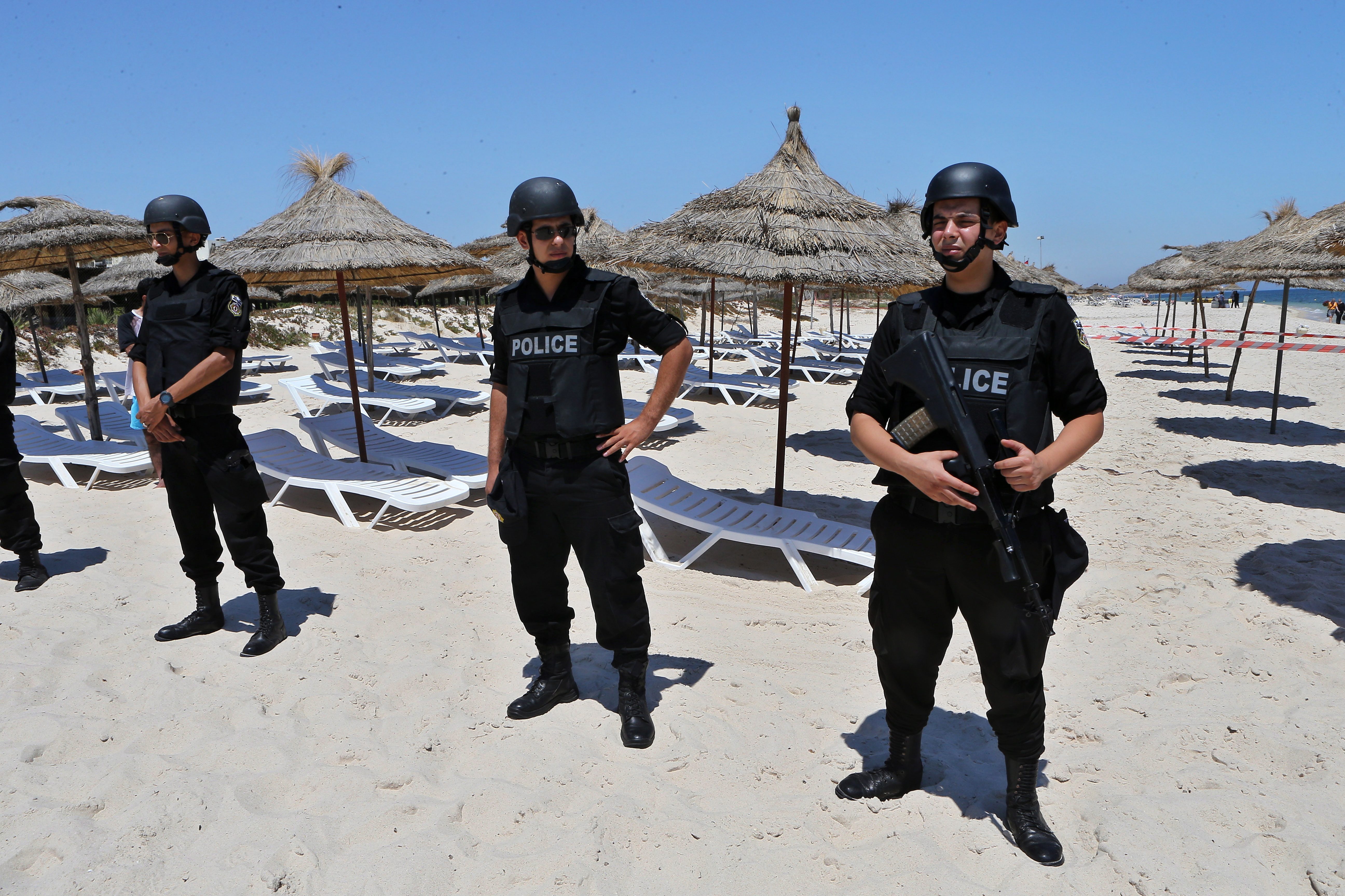 TRAGEDY. Tunisian security services stand guard during a July 3, 2015 memorial ceremony for the victims of the June 26, 2015 terror attack on a beach in Tunisia. File photo by Mohamed Messara/EPA 