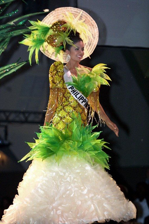 PINEAPPLE DRESS. Carla Gay Balingit, Miss Philippines 2003, wears a typical fantasy dress during the Miss Universe 2003 competition, in Panama City on May 26, 2003.  File photo Teresita Chavarria/AFP 