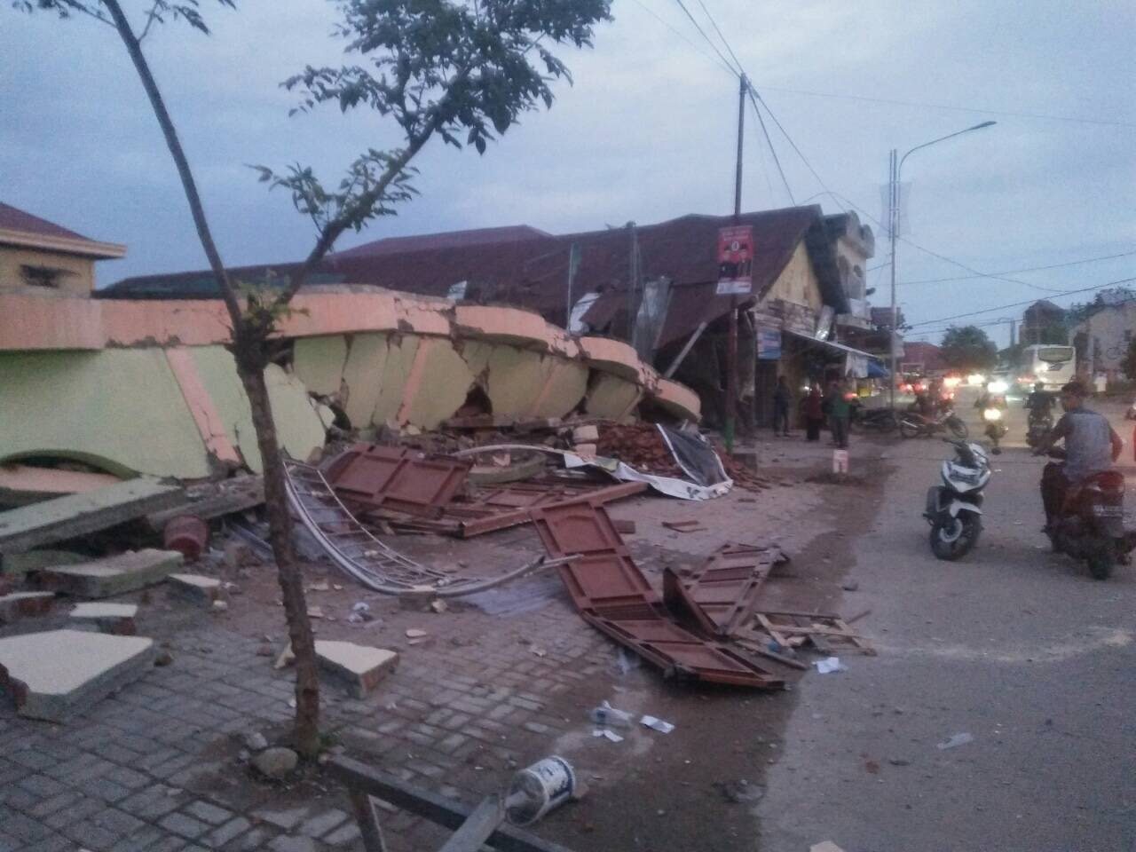 Indonesia quake toll jumps to 97 as more bodies found in rubble
