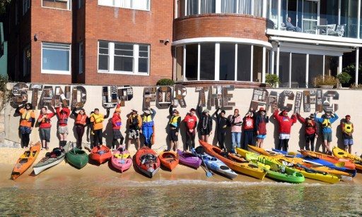 Climate protesters kayak to Australian PM’s harborside home