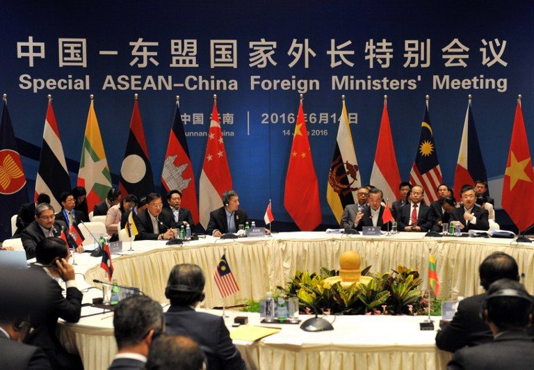 Chinese Foreign Minister Wang Yi (3rd R) and foreign ministers from ASEAN-member nations attend a special ASEAN-China foreign ministers' meeting in Yuxi, southwest China's Yunnan Province on June 14, 2016. Stringer/AFP 