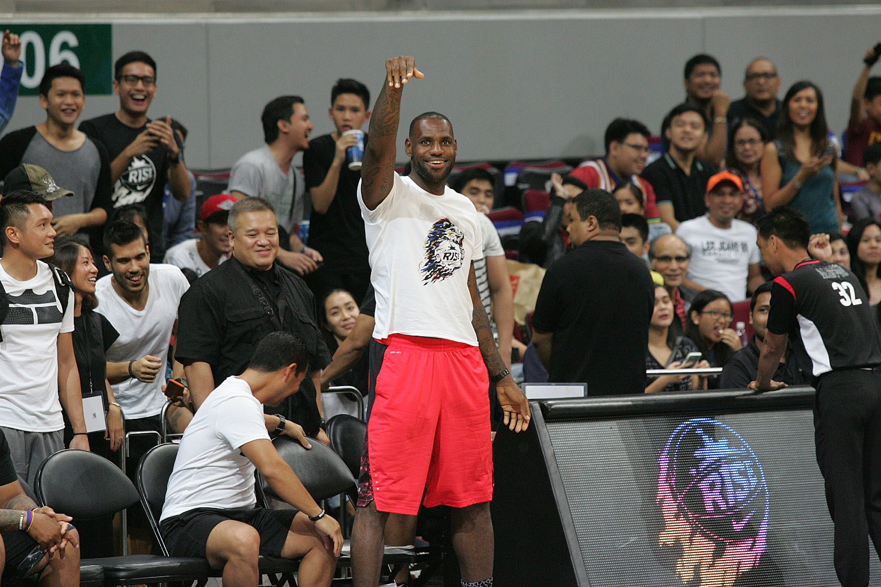 JAMES FOR 3. LeBron makes a 3-pointer while sitting on the bench as teams warmed up. He is seen here on his feet after the shot, marvelling his handy work. Photo by Josh Albelda/Rappler 