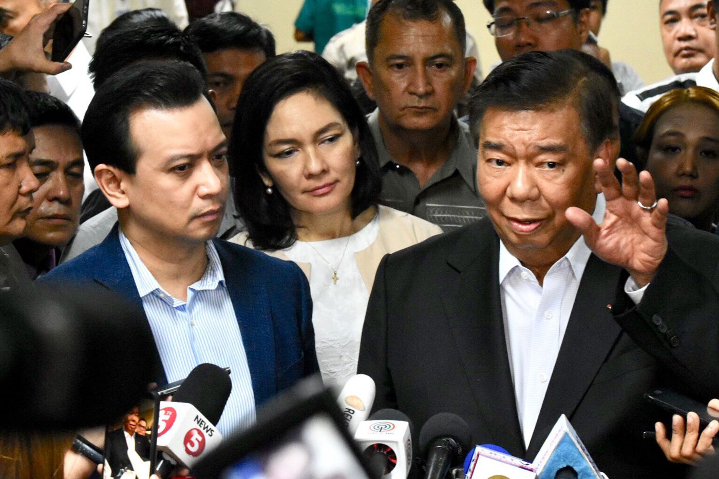AMNESTY REVOKED. Senator Antonio Trillanes IV (L) faces the media regarding the arrest order on him following the revocation of his amnesty. Senate President Vicente Sotto III did not allow the arrest of Trillanes inside the Senate premises. Photo by Angie de Silva/Rappler   