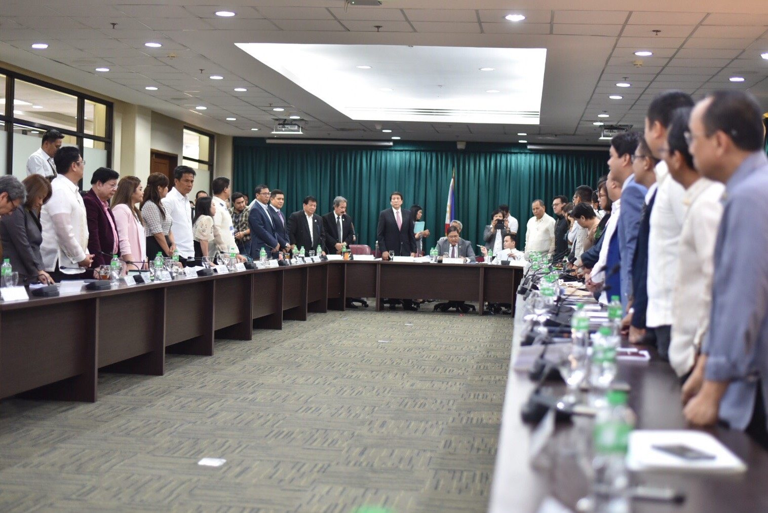NO TO OUSTER PLOT. 42 members of the House committee on justice rise to manifest their vote rejecting the impeachment complaint against the President on May 15. Photo by LeAnne Jazul/Rappler 