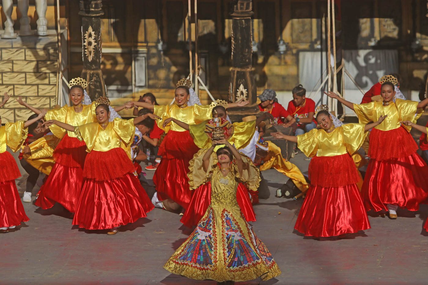 HOLY CHILD. A dance holds the Santo Niño above her head  