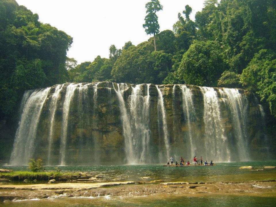 TINUY-AN FALLS. Its water falls in a 95-meter wide curtain. Photo by Ros Flores 