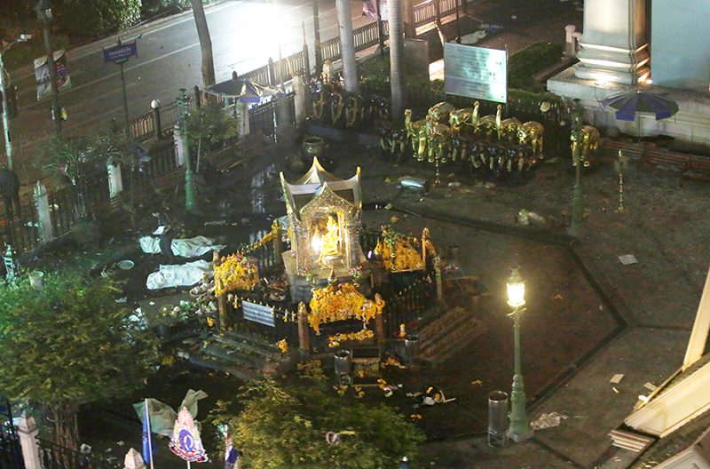 EXPLOSION. A general view taken from a moving train shows the scene at the Erawan Shrine after a bomb explosion, central Bangkok. Barbara Walton/EPA 