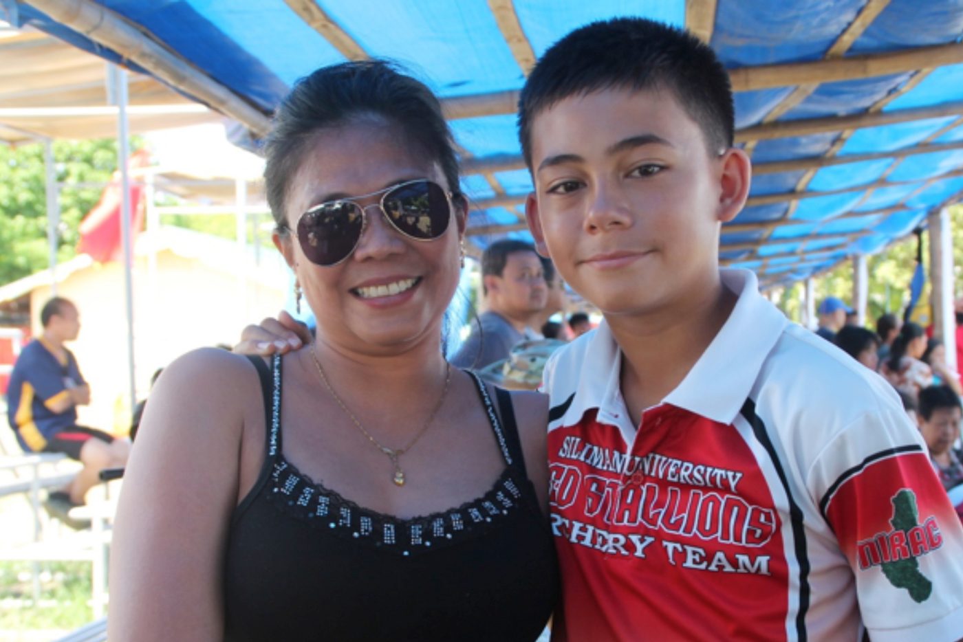 BOW AND ARROW. Elisa Hastie (L) show her support to archer son, Carson Francis, after competing at Pis-anan National High School Grounds on Thursday, April 27. Elisa flew all the way from Dumaguete to watch her son play. "We're excited because it's his first time (to join the Palarong Pambansa)." 