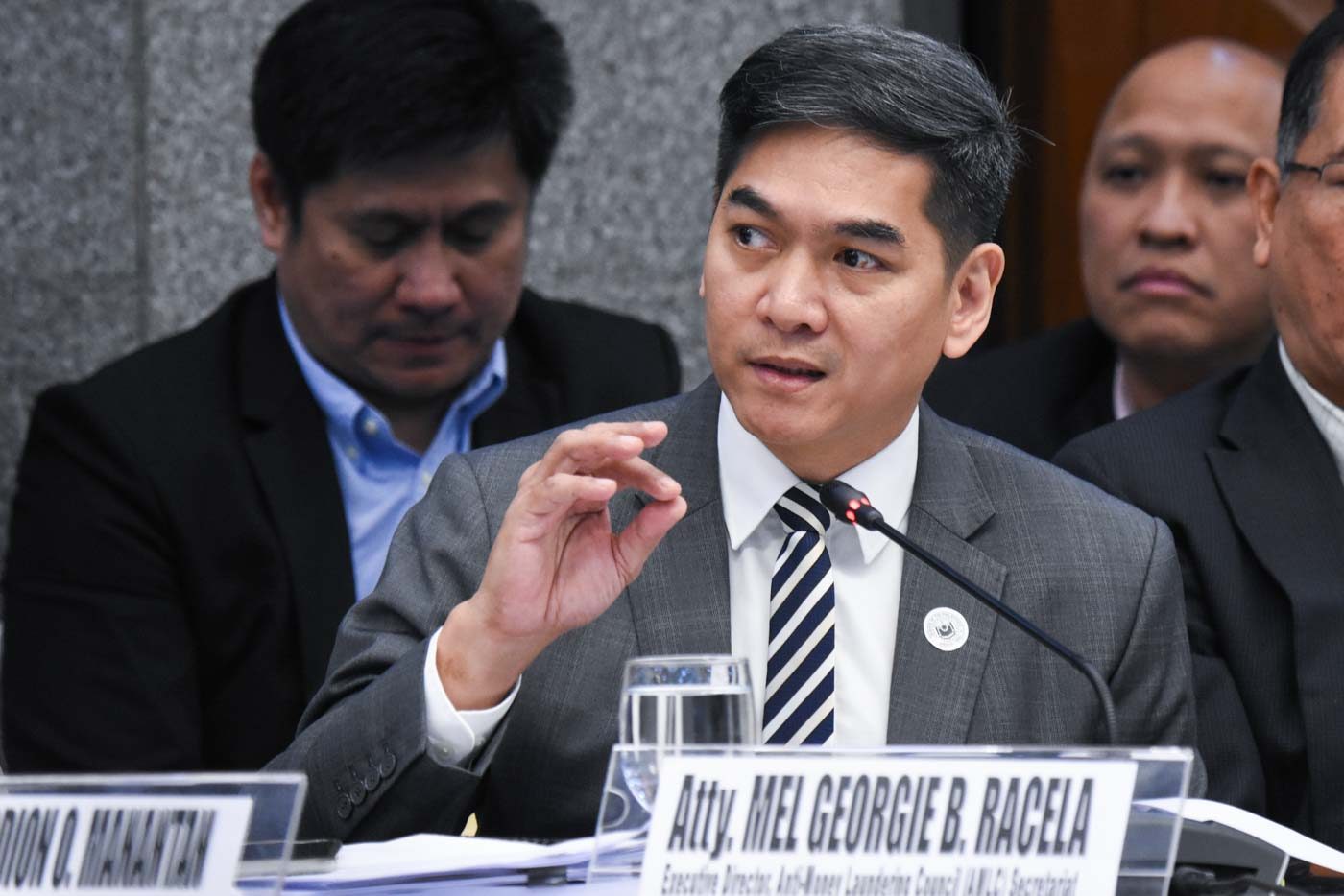 WHY SLOW? Beleaguered AMLC Executive Director Mel Racela takes questions from senators. Photo by Angie de Silva/Rappler 